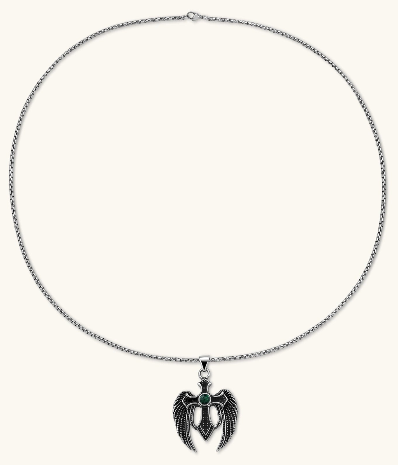 Silver stainless steel angel wing cross pendant necklace with green CZ center stone and black crystals on a box chain.