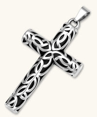 Silver stainless steel Celtic cross pendant with filigree vine pattern on a box chain, against a cream background.