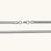 Two-tone twisted necklace with interlocked gold and silver ribbed snake chains, 6mm wide, on a white background.