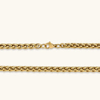 18K gold-plated stainless steel wheat chain necklace, 4.2mm wide, with lobster clasp, on off-white background.
