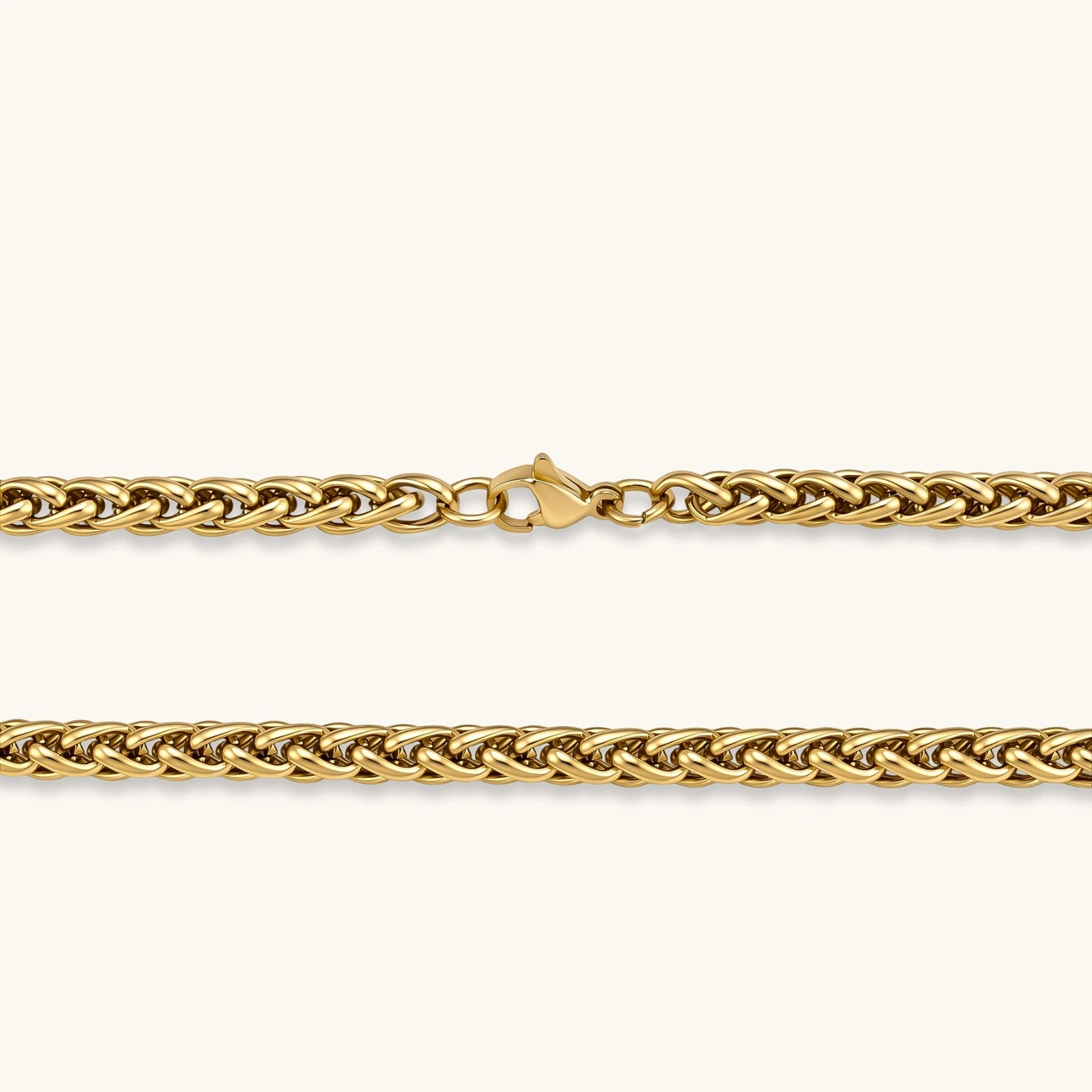 18K gold-plated stainless steel wheat chain necklace, 4.2mm wide, with lobster clasp, on off-white background.