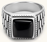Silver stainless steel signet ring with checkered band texture, beaded border, and square black onyx cabochon stone center.
