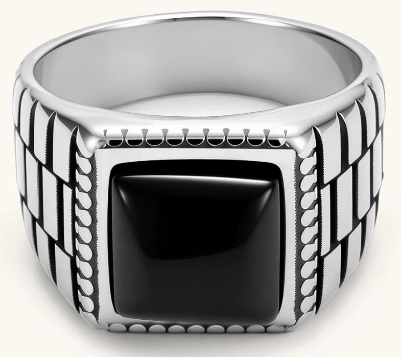 Silver stainless steel signet ring with checkered band texture, beaded border, and square black onyx cabochon stone center.