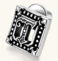 Square 925 sterling silver stud earring with oxidized Gothic letter, ornate dot border, fleur-de-lis corners, butterfly back.