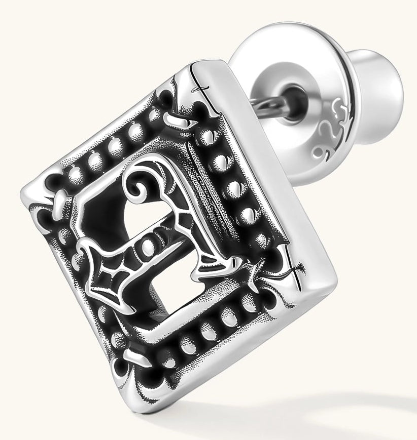 Square 925 sterling silver stud earring with oxidized Gothic letter, ornate dot border, fleur-de-lis corners, butterfly back.