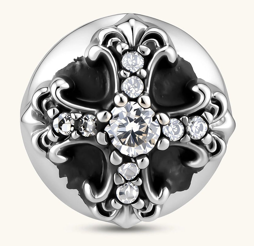 Sterling silver dome stud earring with oxidized black petals, ornate scrollwork, and clear cubic zirconia stones, butterfly back.