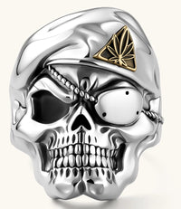 925 sterling silver skull ring wearing a military beret with a gold triangular cannabis leaf badge, blackened eye sockets, 23.9g.
