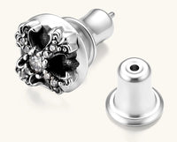 Sterling silver dome stud earring with oxidized black petals, ornate scrollwork, and clear cubic zirconia stones, butterfly back.
