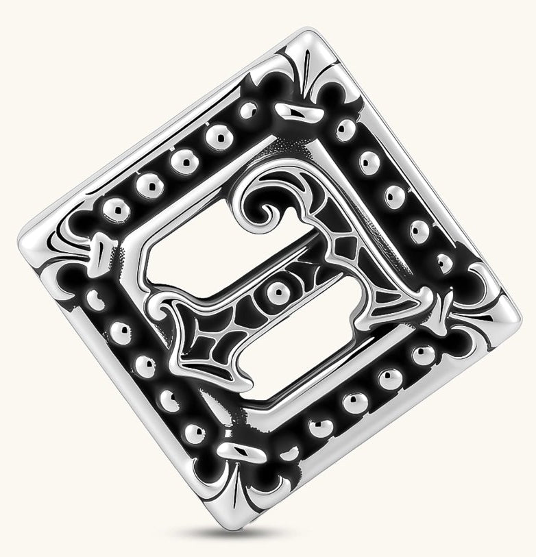 Square 925 sterling silver stud earring with oxidized Gothic letter, ornate dot border, fleur-de-lis corners, butterfly back.