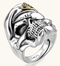 925 sterling silver skull ring wearing a military beret with a gold triangular cannabis leaf badge, blackened eye sockets, 23.9g.